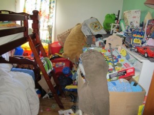 bedroom overflowing with junk