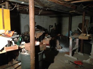 paint, scraps, and debris in basement