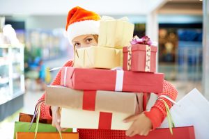 woman with pile of christmas presents