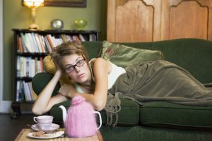 woman lying on couch