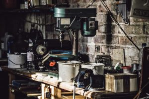 Cluttered tool bench in dark garage